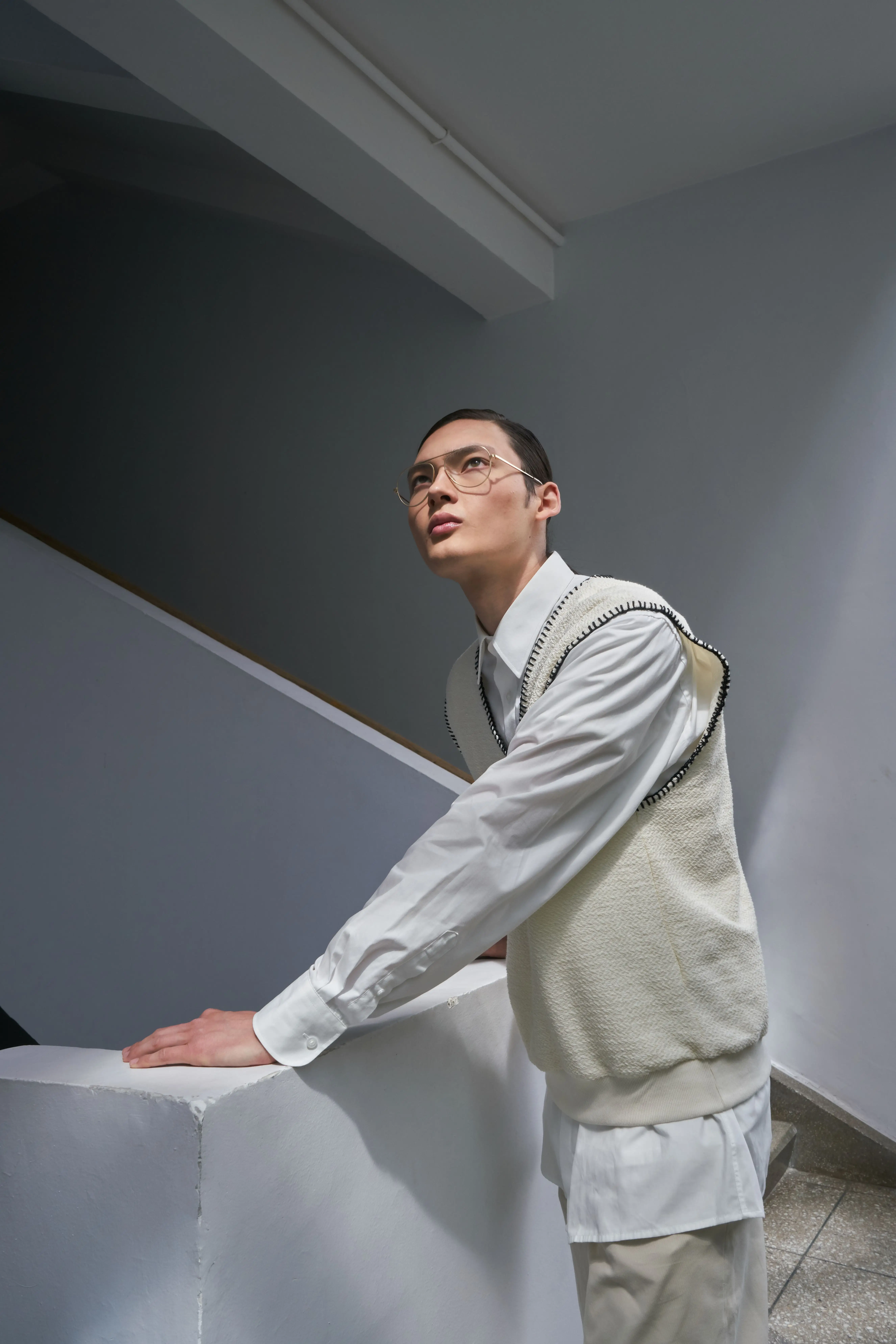 Ivory Sweater Vest worn by a model.